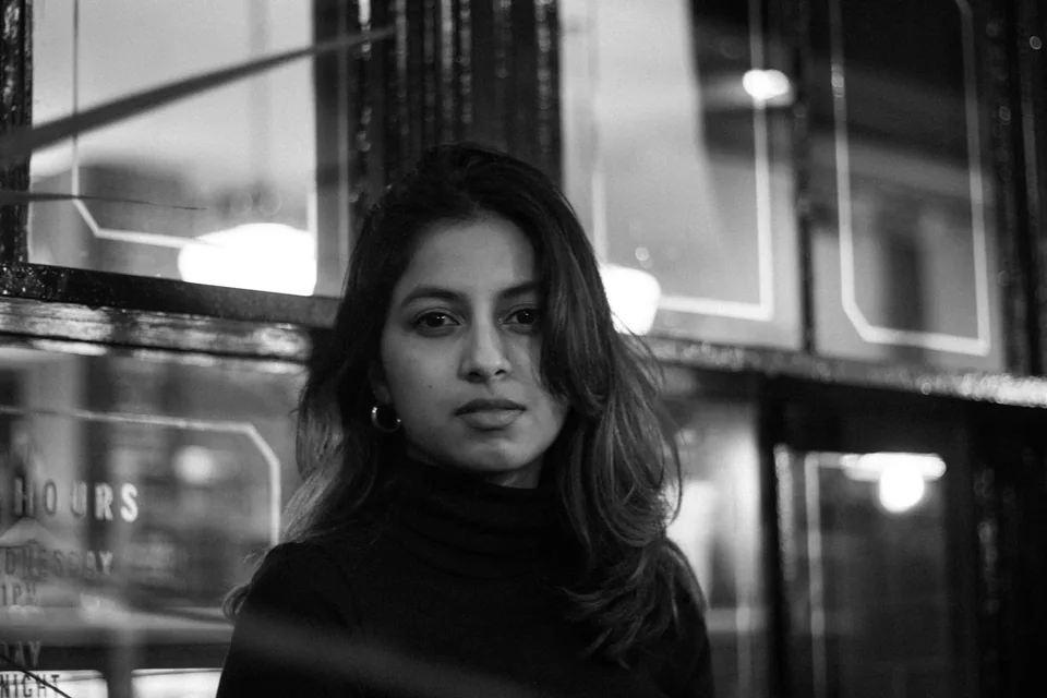 Close monochrome portrait of Shrinkhla with city lights
